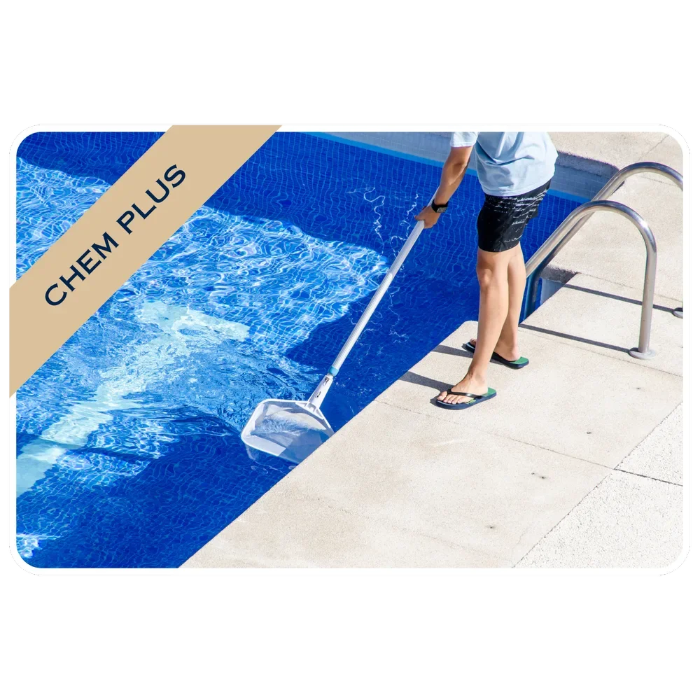 Person cleaning a swimming pool with a net skimmer, wearing flip flops and casual clothes.