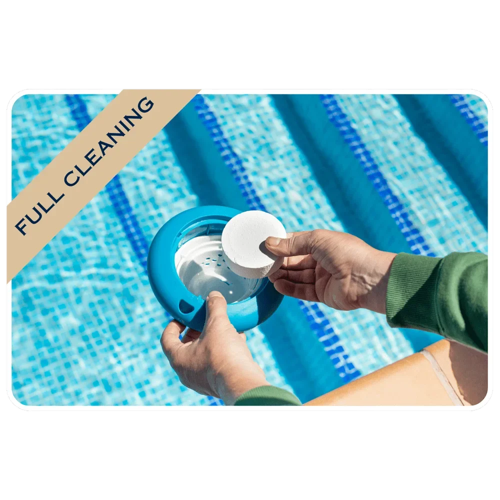Person cleaning a pool filter with a round cleaning tool, set near a blue tiled swimming pool.