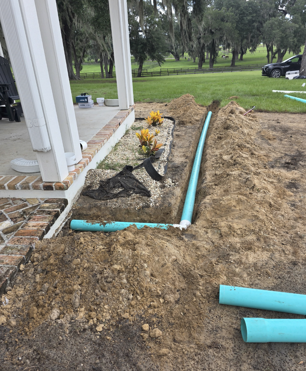 Why Ocala Homeowners Are Burying Their Gutters: The Underground Downspout Advantage