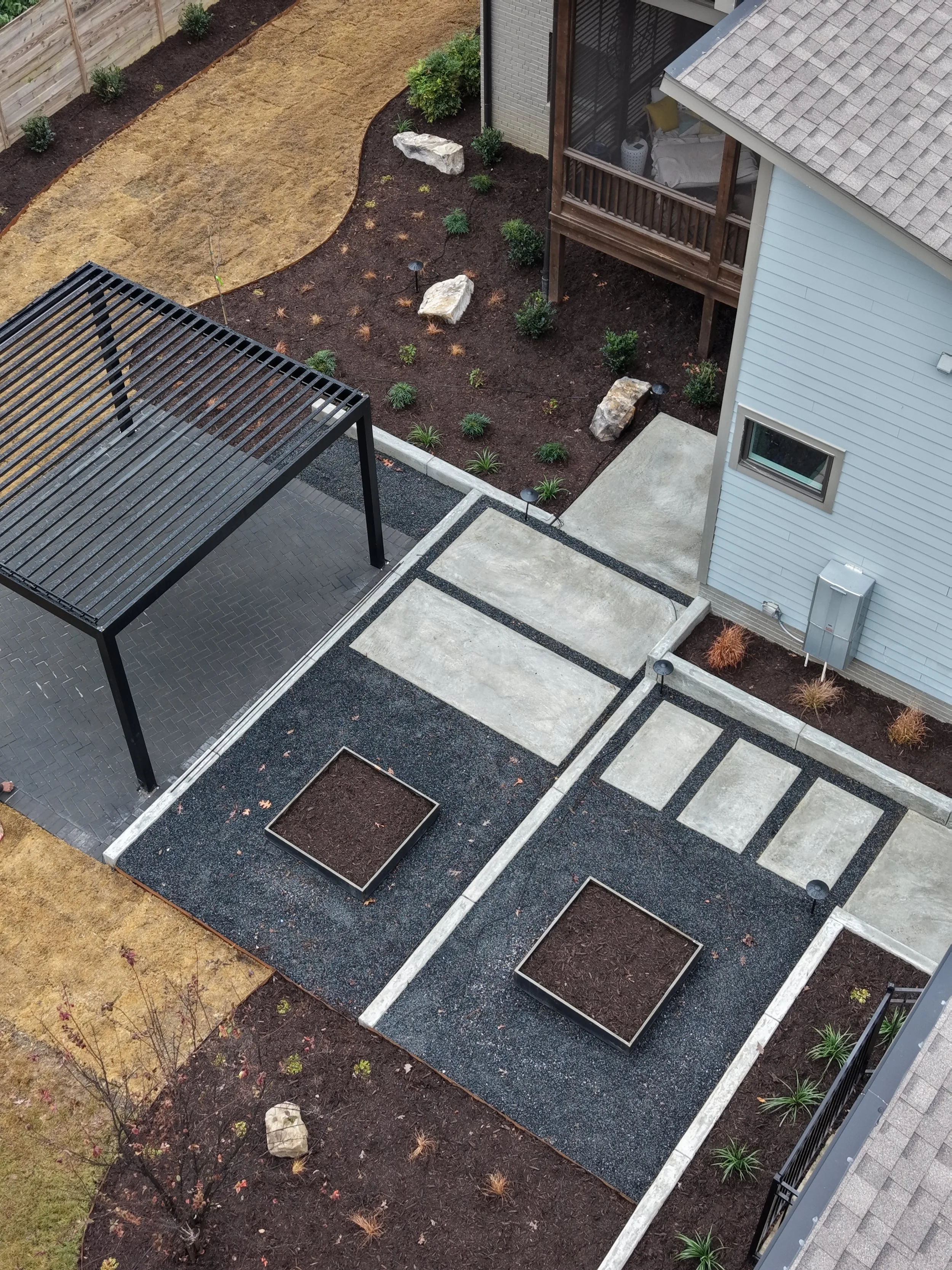 Modern outdoor living space design with pergola installation in Cary, NC