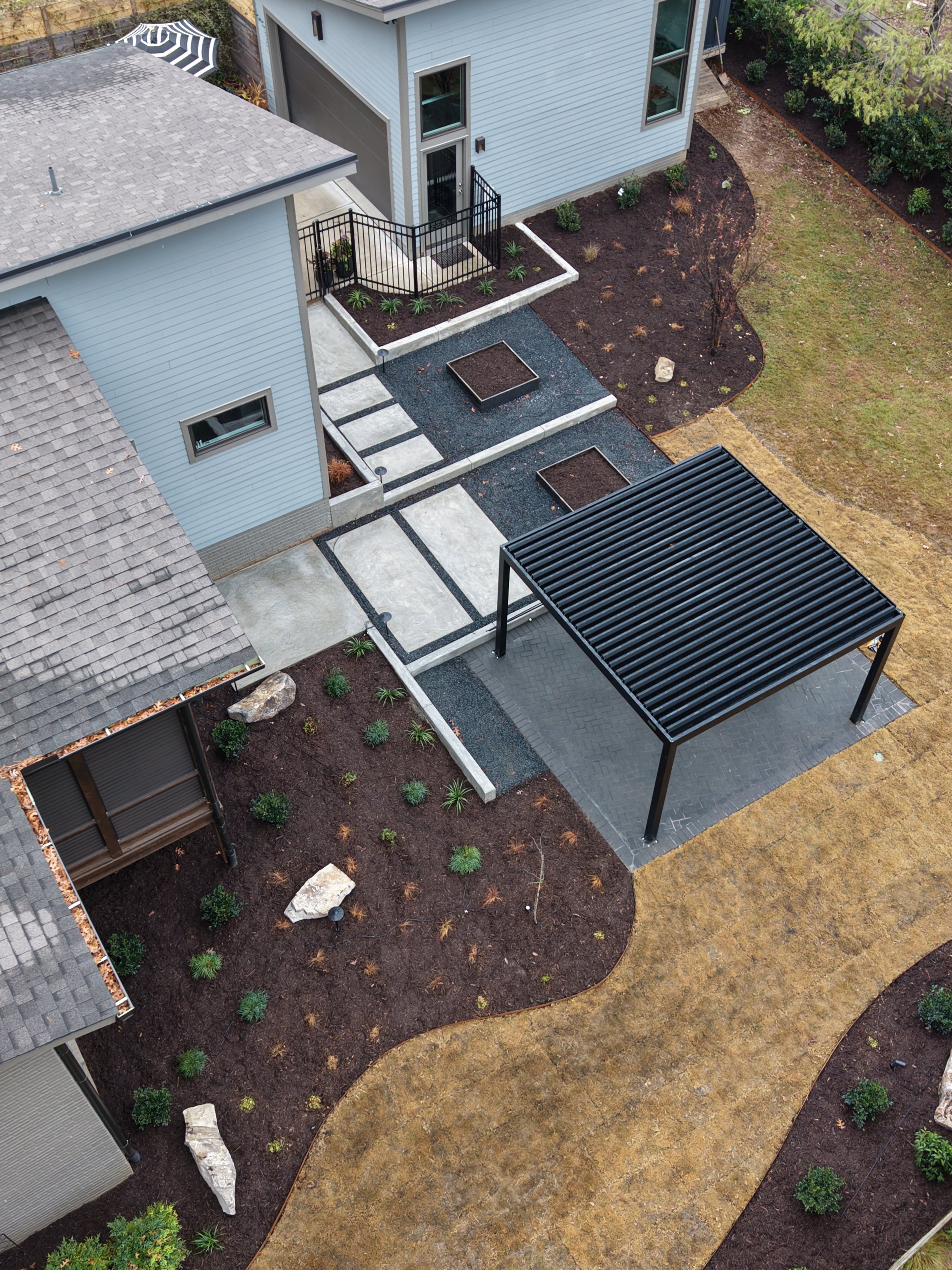 Poured-in-place concrete walls in multi-level outdoor living space in Cary, NC