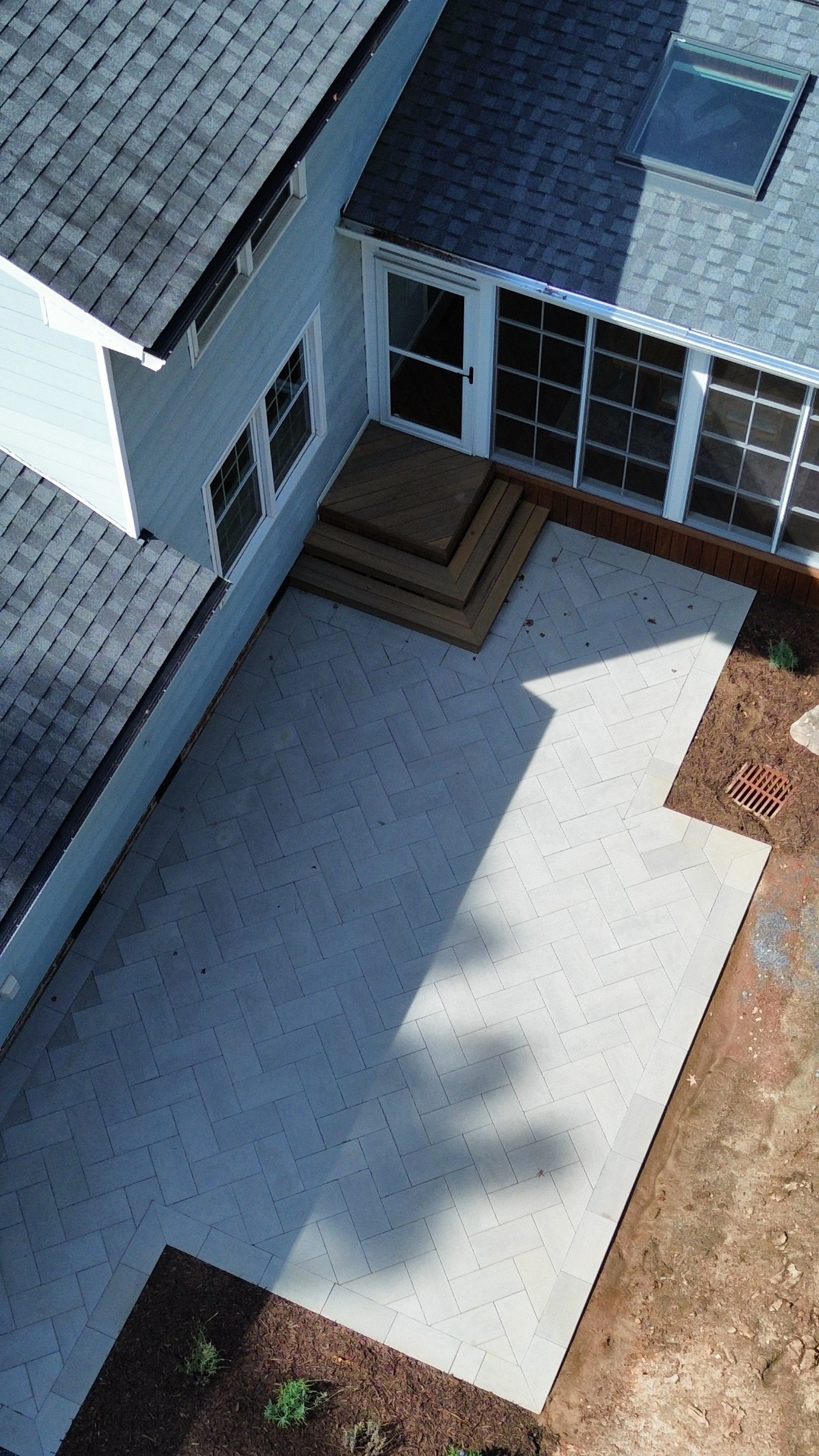 Paver patio with herringbone pattern under construction in Cary, NC