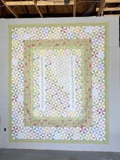 Here is an overall view of the newly expanded quilt.  I took great care to honor the original design, piecing and quilting and all of the beautiful workmanship that went into it.  As you can see, the overall size was greatly increased, but the overal