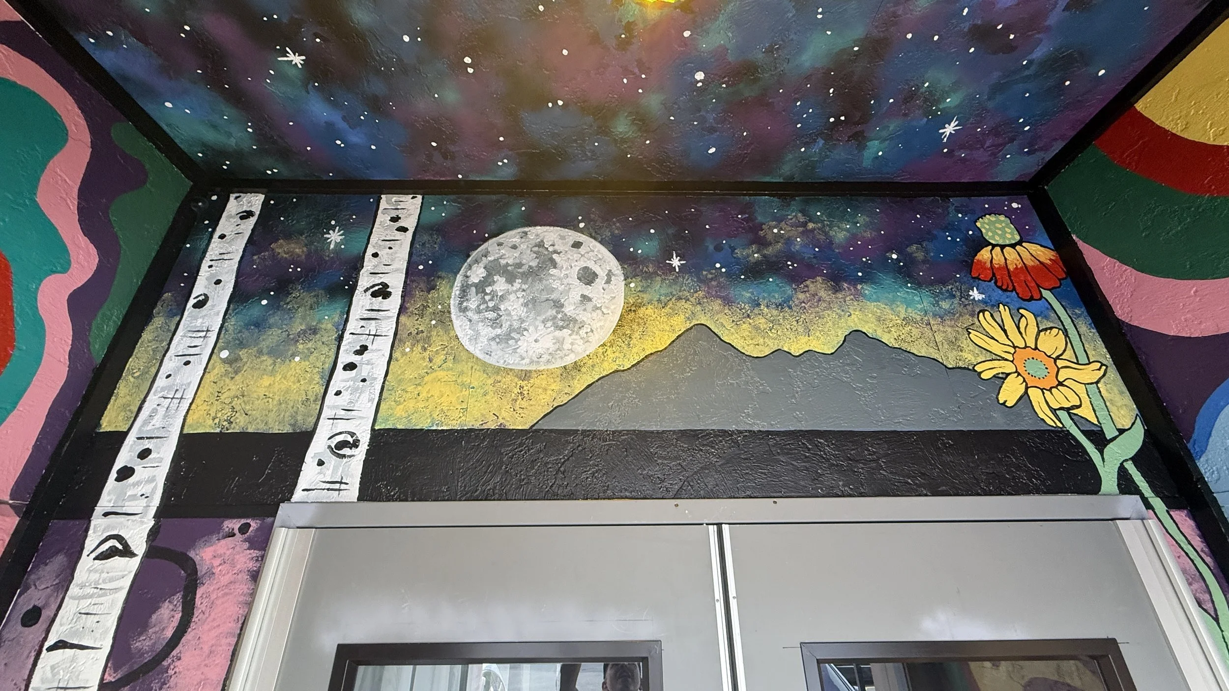 The top of the mural at the entryway leading into Beaver Street Theatre.
