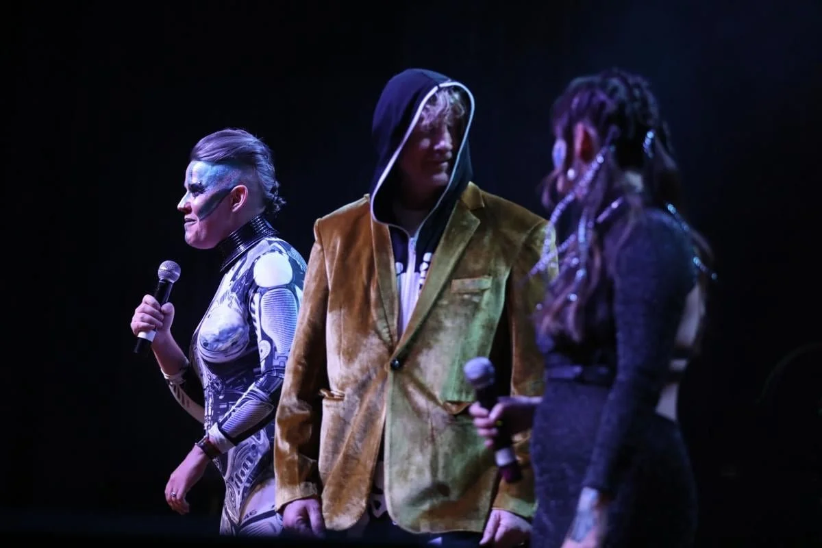 Kayley Quick, Doug Quick and Carlie Nannini open the Robot Apocalypse show onstage in 2024.