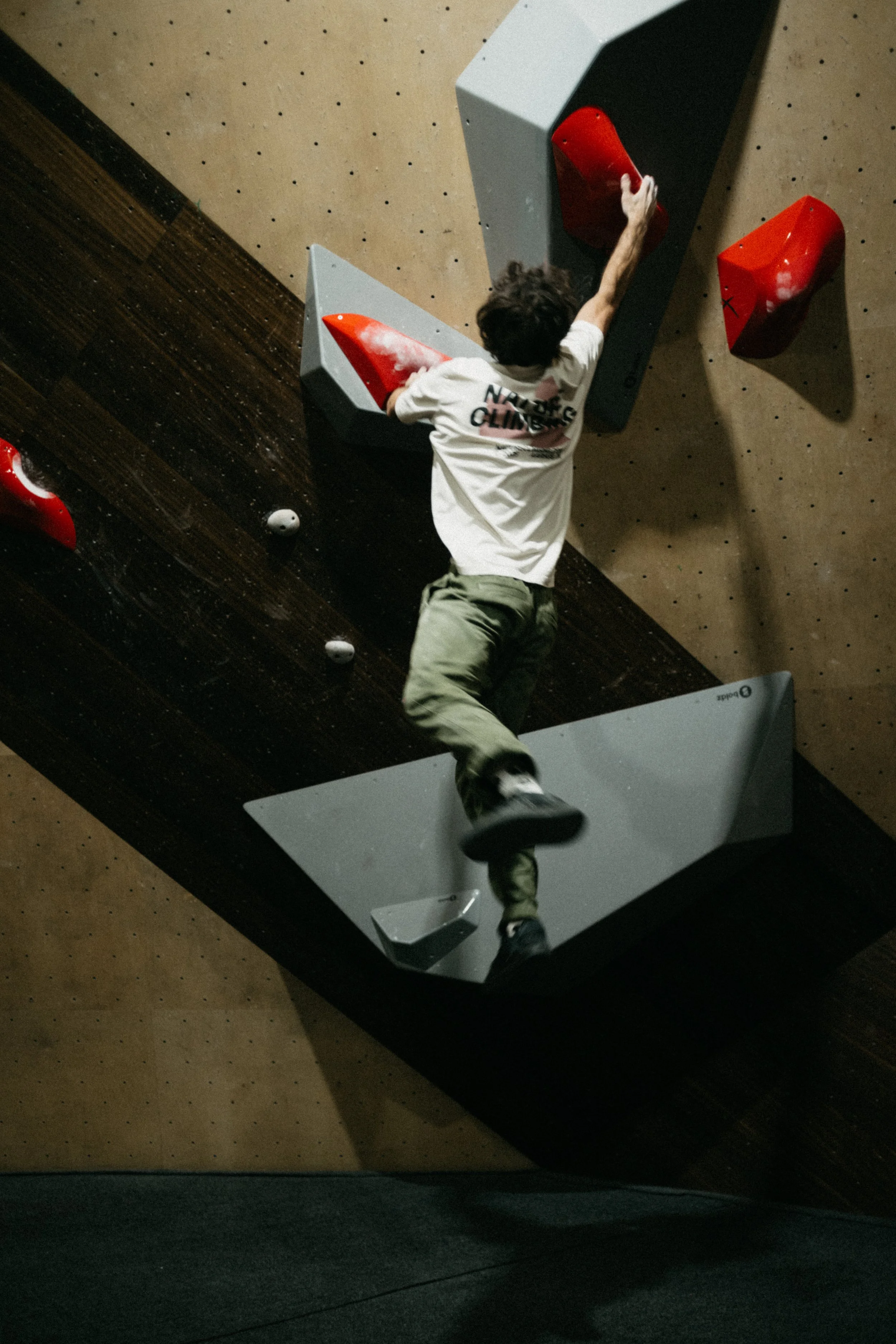 Routesetter testing the finals for Tba 4 at Climbing District Paris on Boldz Holds Double texture Volumes


