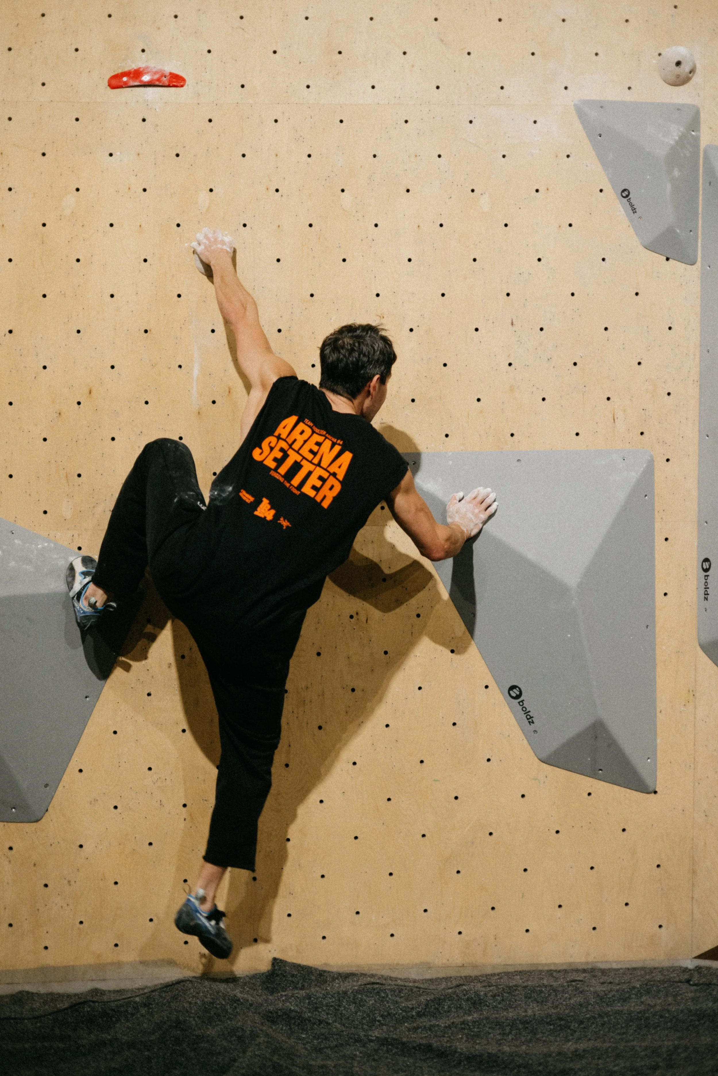 Routesetter testing the finals for Tba 4 at Climbing District Paris on Boldz Holds Double texture Volumes


