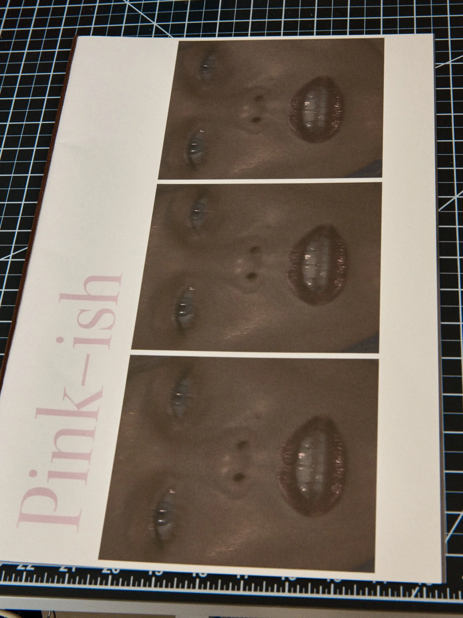 A sheet with three identical printed images of a woman's face, focusing on her lips, nose, and eyes, with the words 'PINK-i-SH' written vertically along the left side.