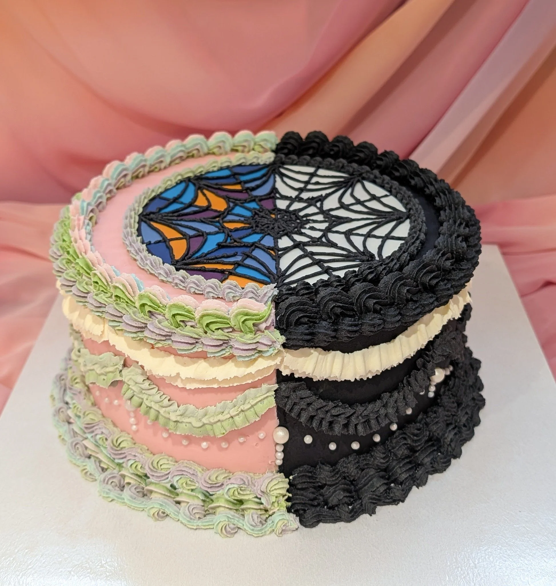Vanilla cake with a split design inspired by Wednesday Addams &ndash; half soft pastel piping, half gothic spiderweb.
This was such a fun one to design!

Custom themed cakes available across Milton Keynes and Bedford.

#wednesdaycake #themedbirthdayc