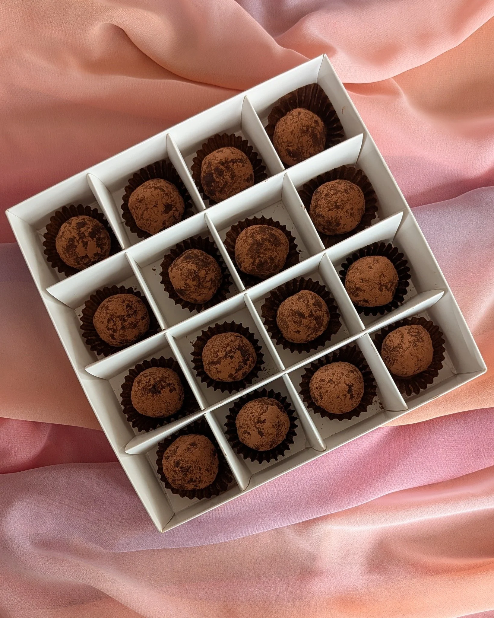 Chocolate date balls made with dates, almonds, pecans and cacao.
A slightly lighter option if you want something sweet but don&rsquo;t necessarily want a full slice of cake.

These work really well as little gift boxes or for sharing after dinner.

#