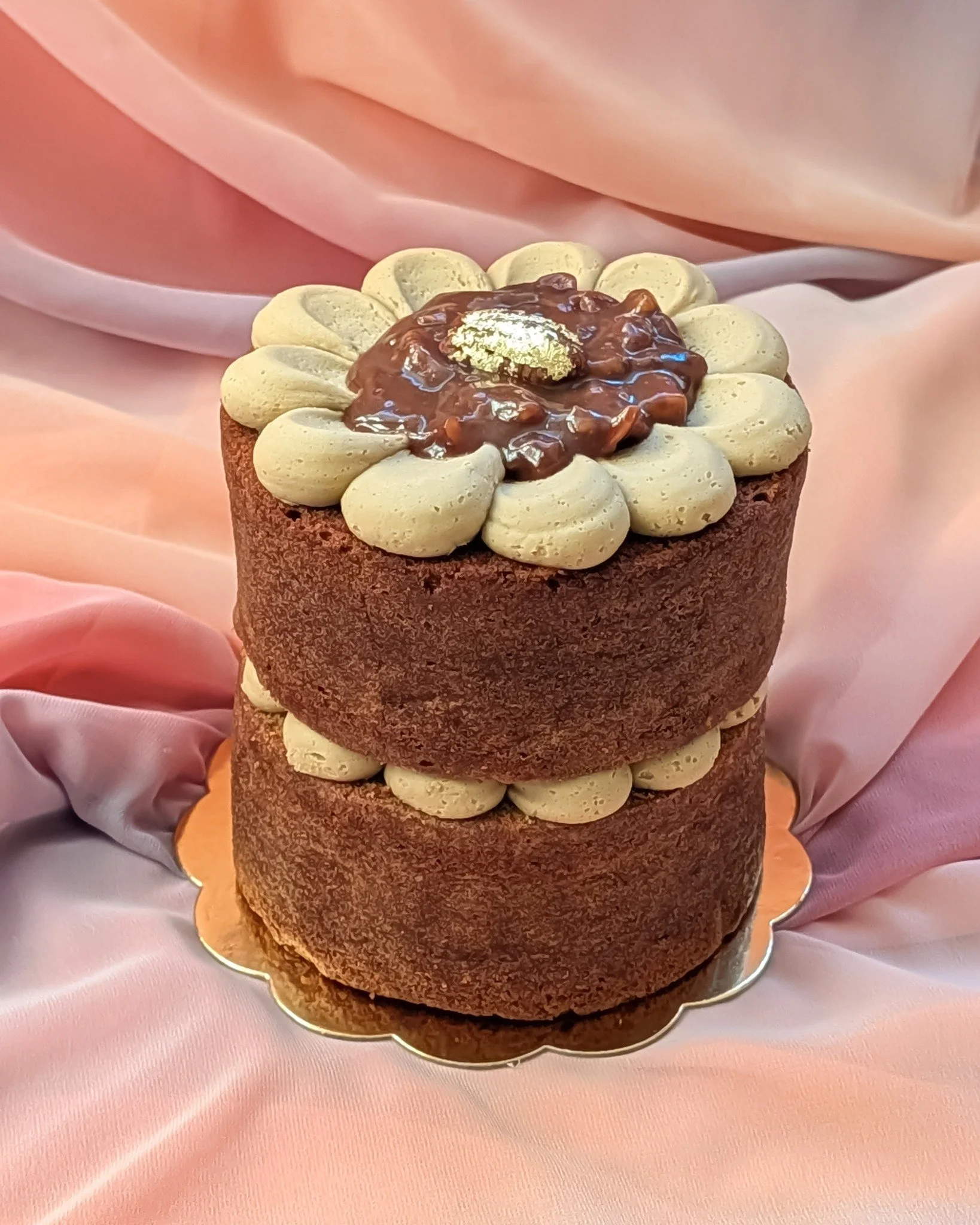 This was a pecan pie-inspired cake: brown sugar sponge, treacle buttercream and a proper pecan pie filling through the middle.
I love turning dessert flavours into cake form &ndash; it&rsquo;s a nice way to make something a bit more personal than a s