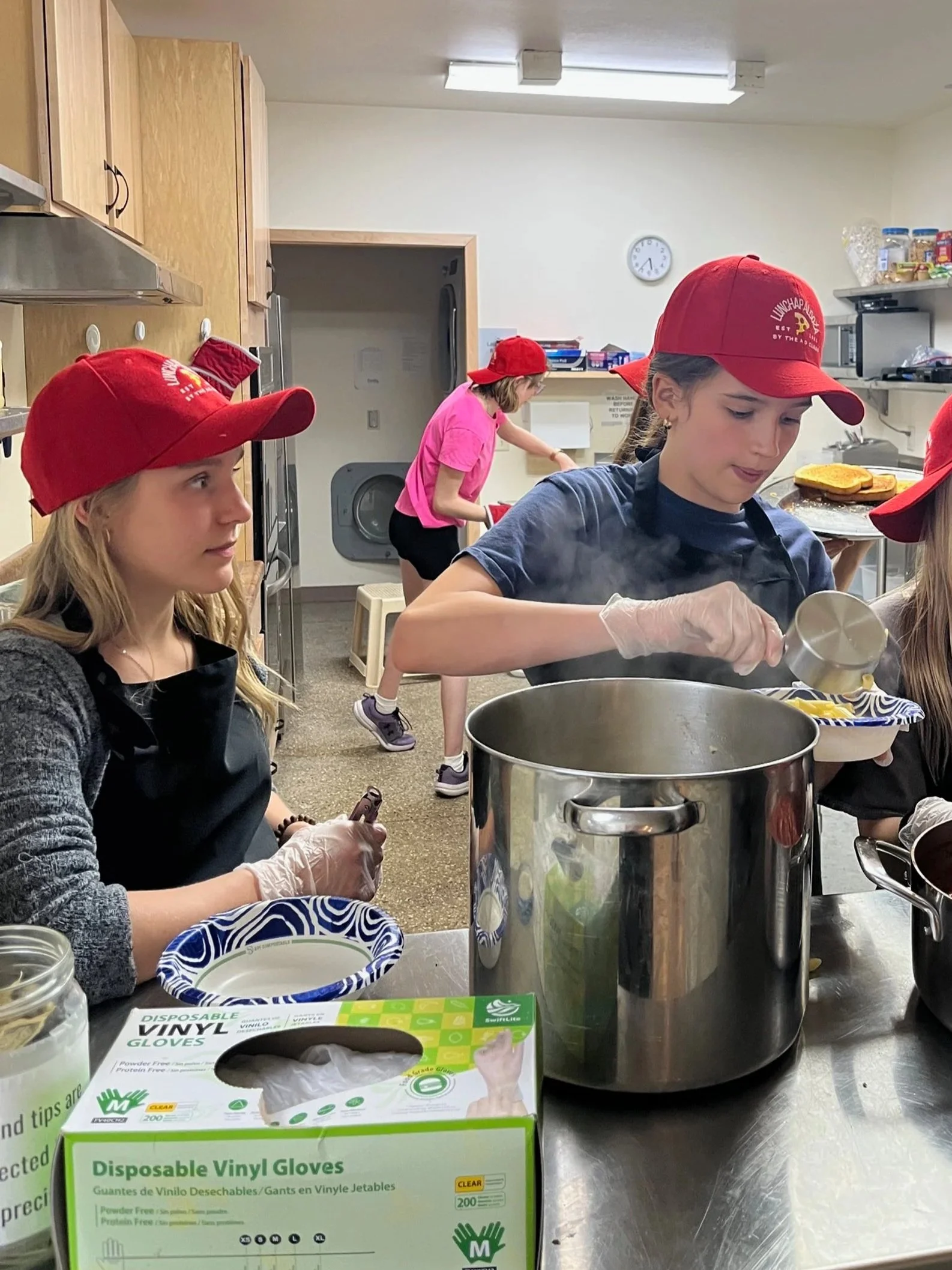 Madison Community Montessori Students cooking lunch for the school-wide lunch program