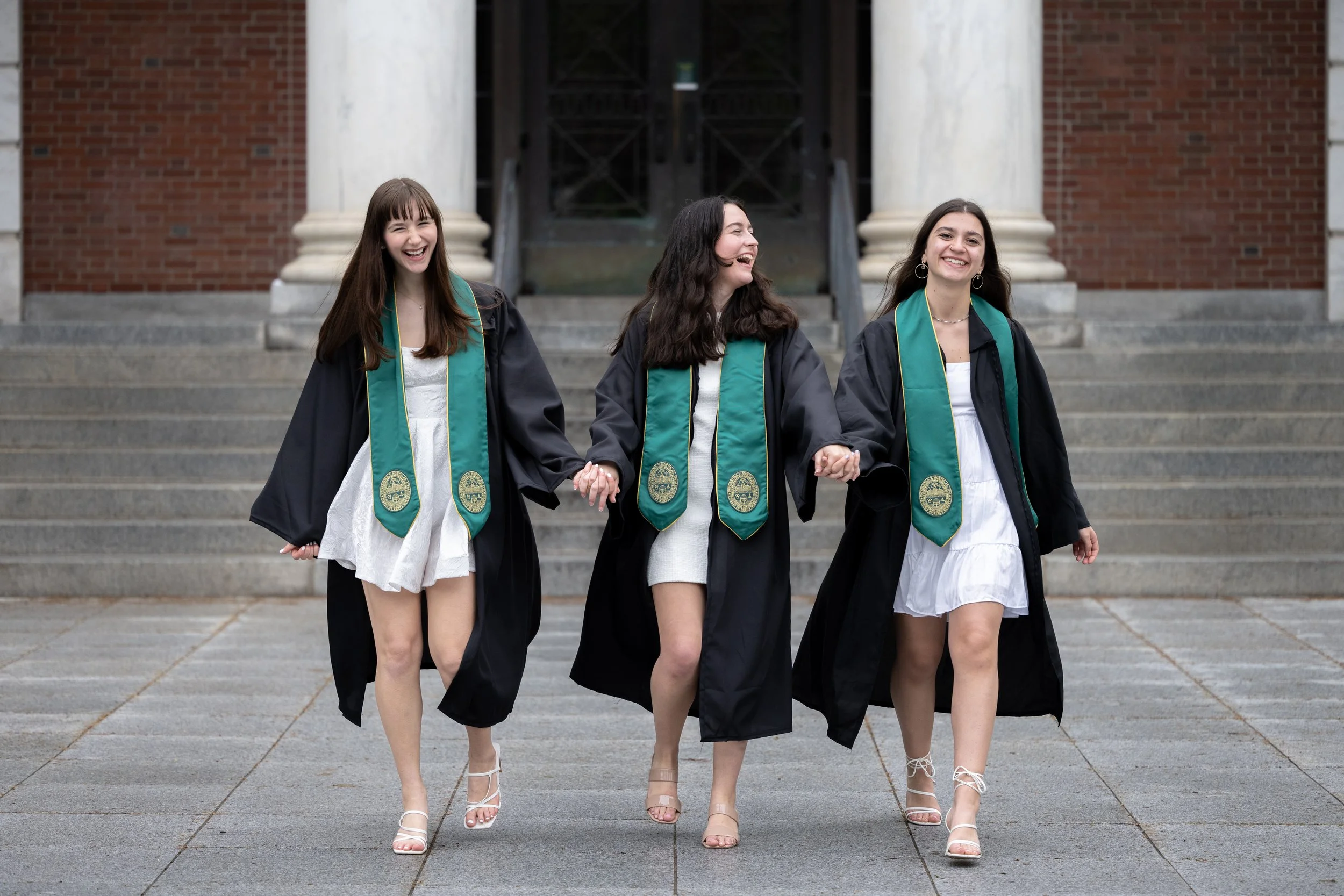 Three-Walking-Laughing-Portrait-Vermont-University-of-Vermont-Graduate-Undergrad-Cap-and-Gown-Photography.jpg