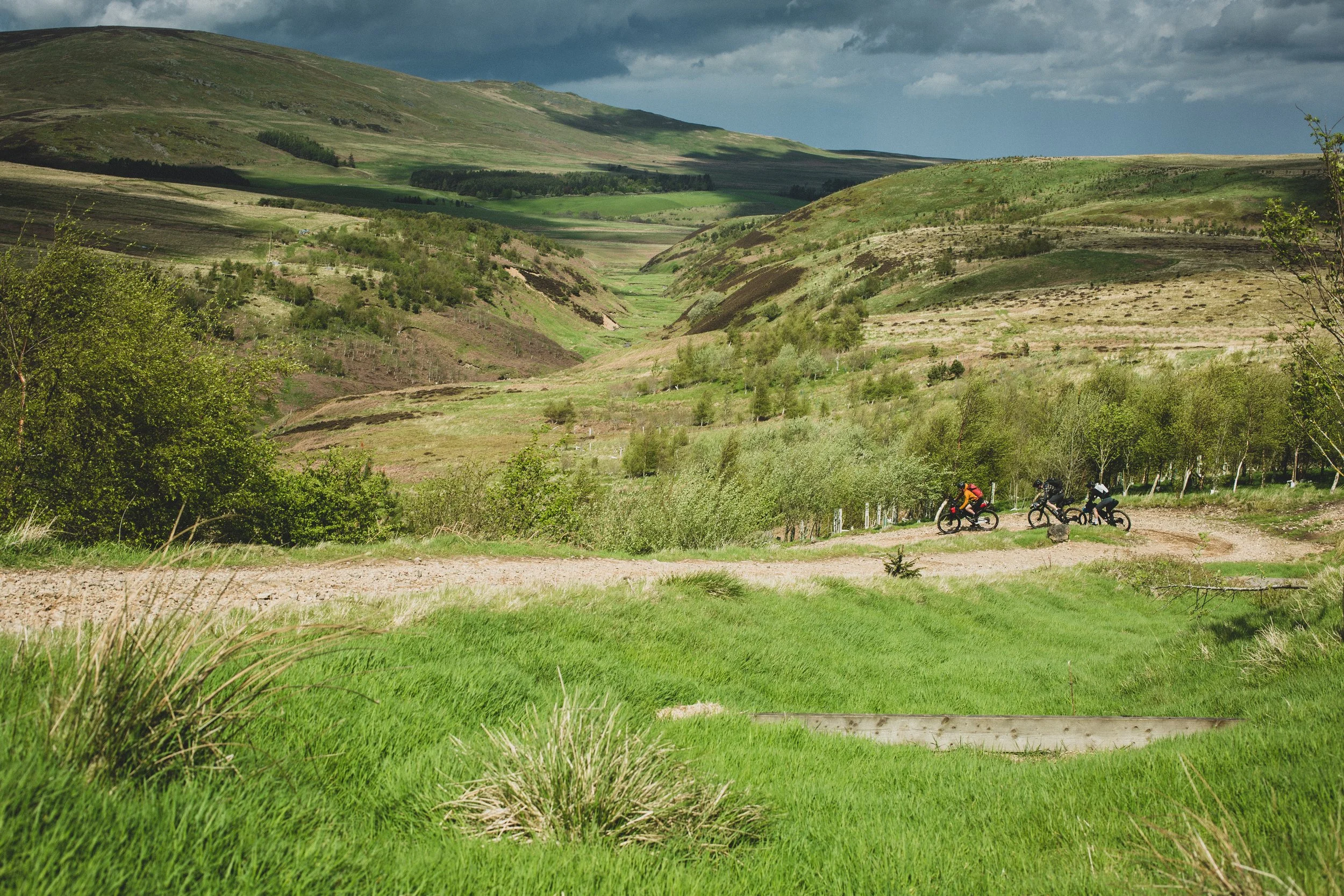 Group of three mountain bikers riding the Slymefoot Trail from Rothbury, Northumberland.