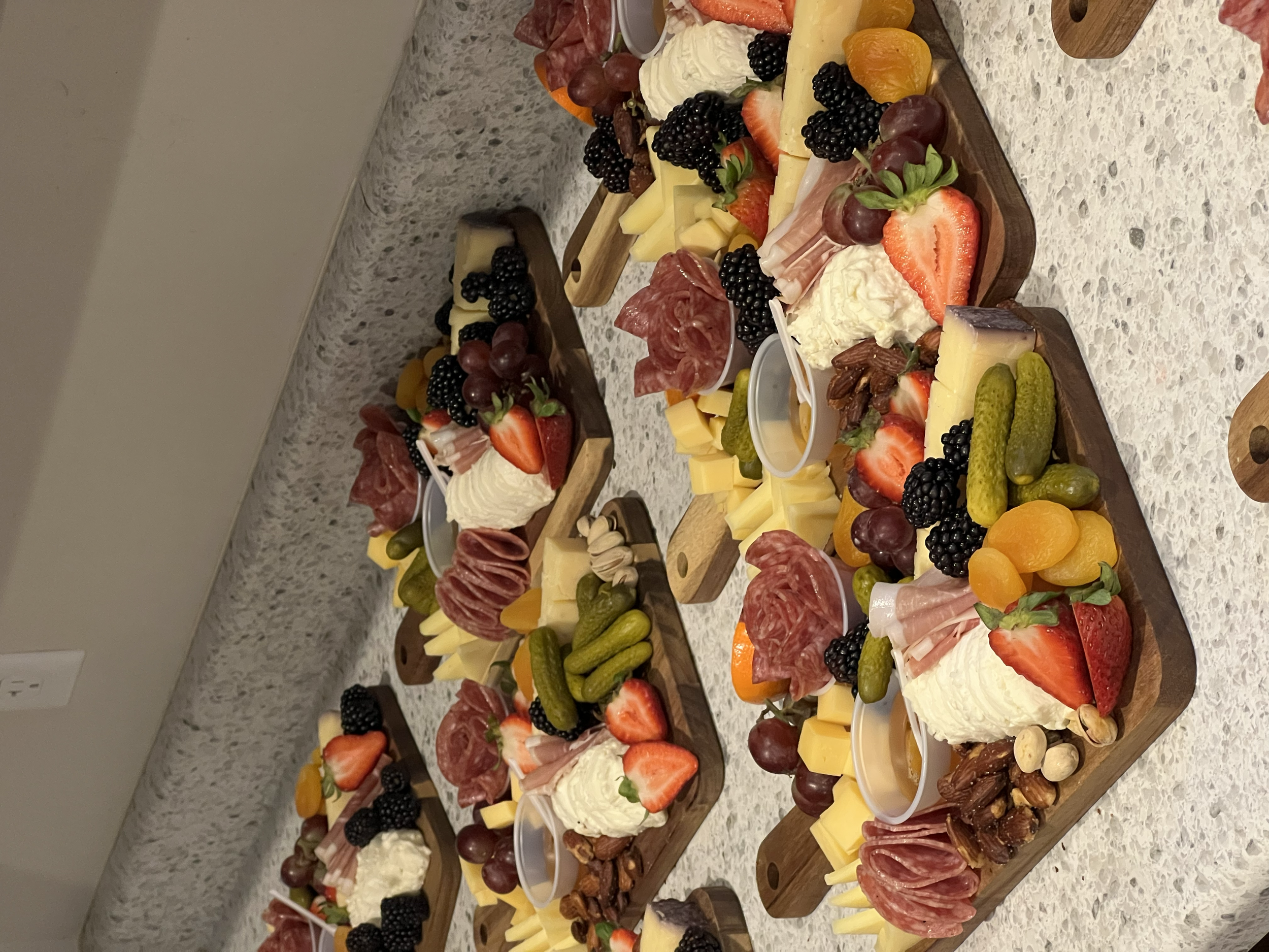 Charcuterie boards assembled and ready to become edible centerpieces at a wedding in Cedar City, Utah.