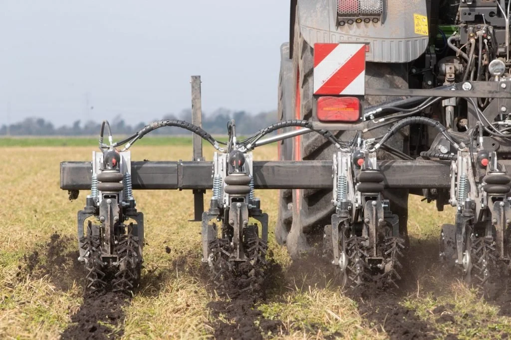 Preparing the row, protecting the soil