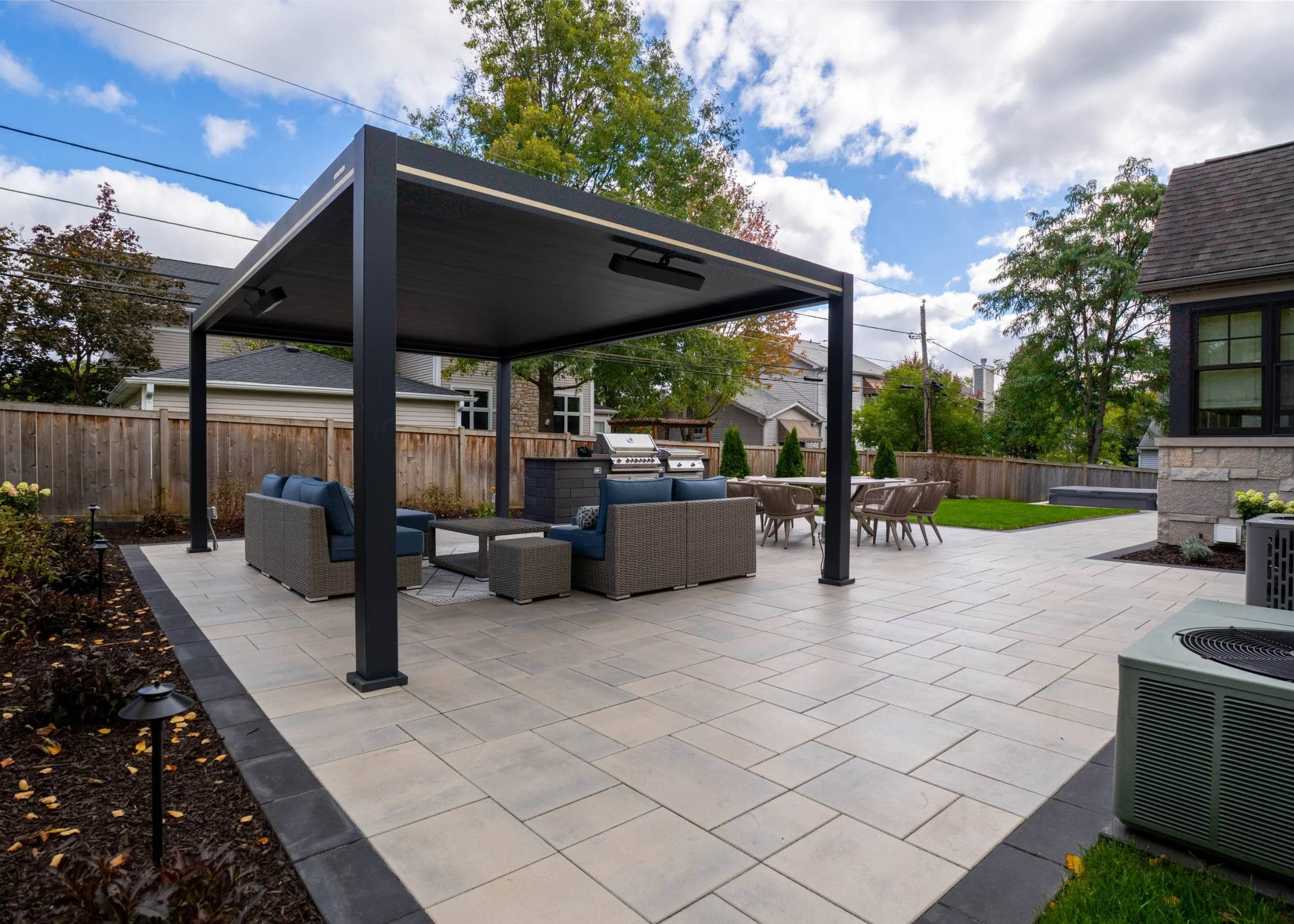 A luxury paver patio paired with outdoor lighting in Naperville, IL