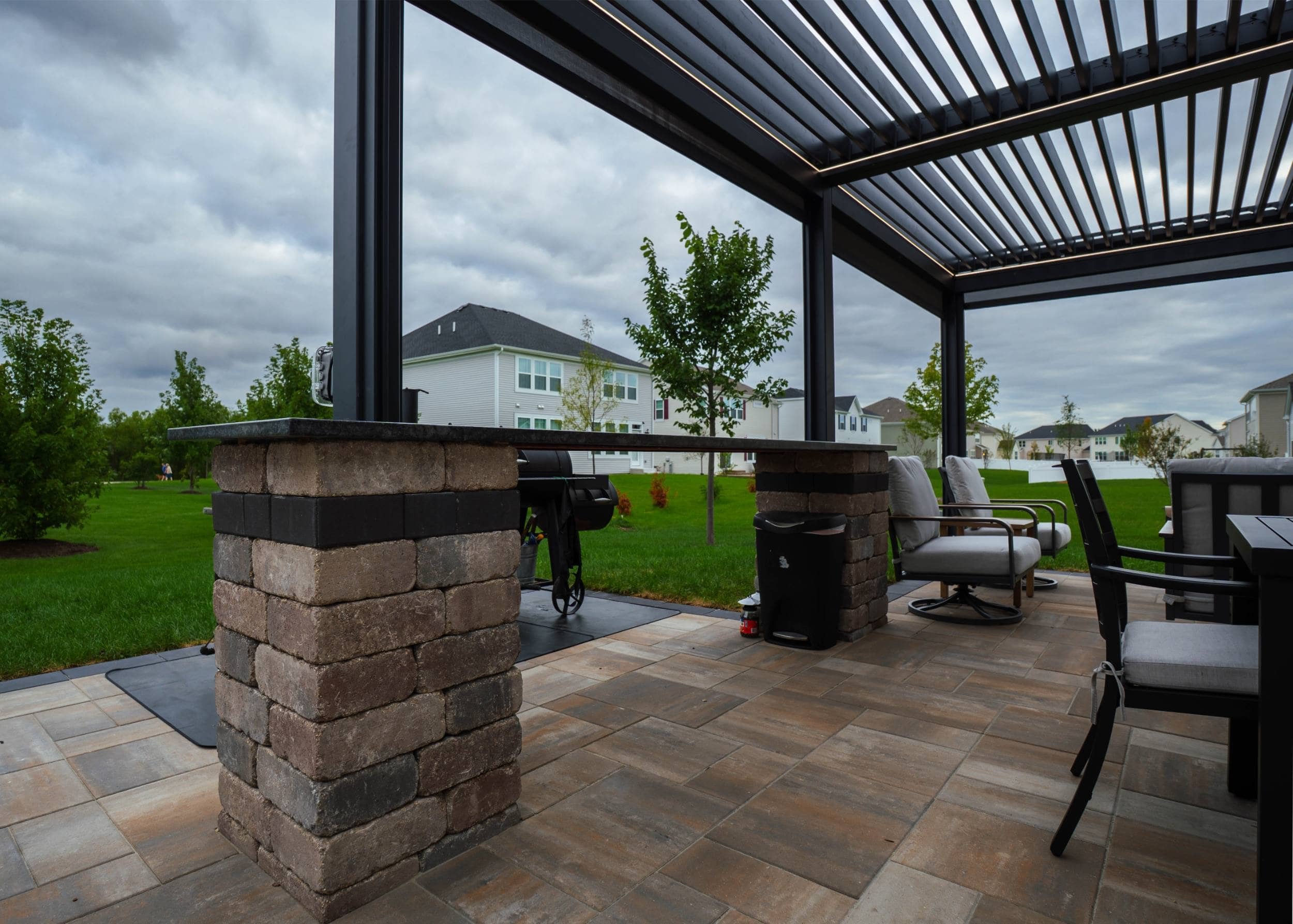 Inviting paver walkway leading to cozy fire pit and seating area in Elmhurst, IL