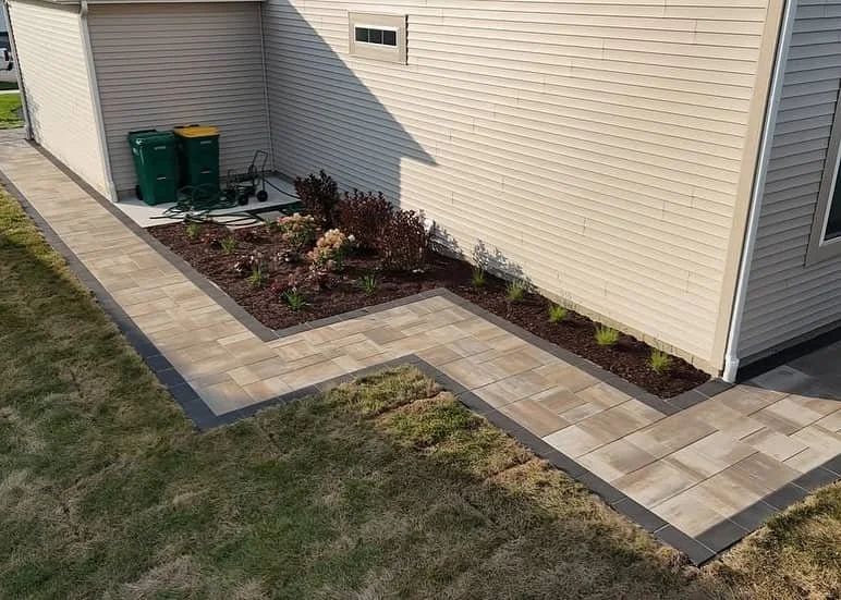 Charming compact backyard featuring paver walkway and outdoor kitchen in Barrington Hills, IL