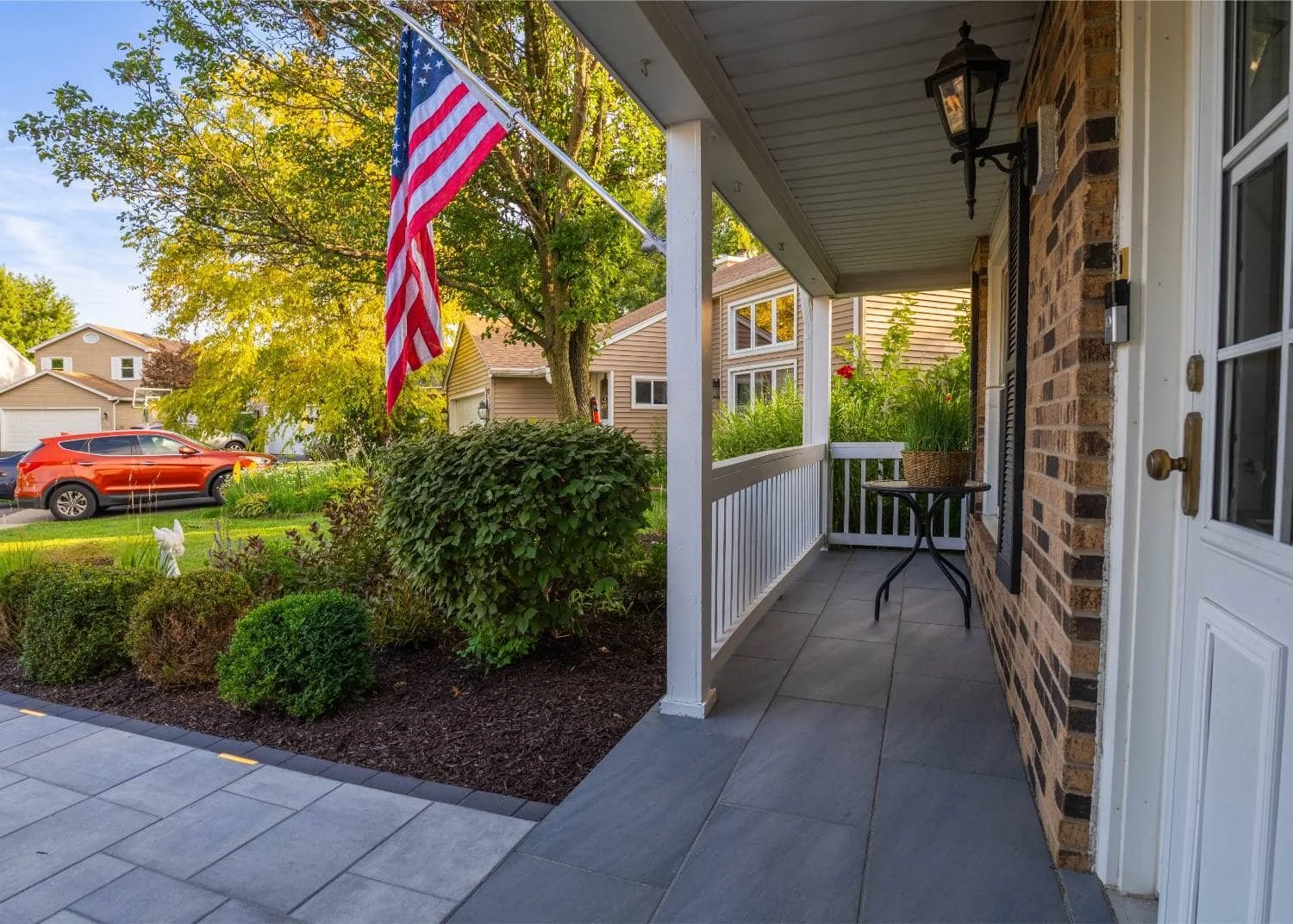 Beautiful paver patio with custom fire pit and seating wall in Wheaton, IL