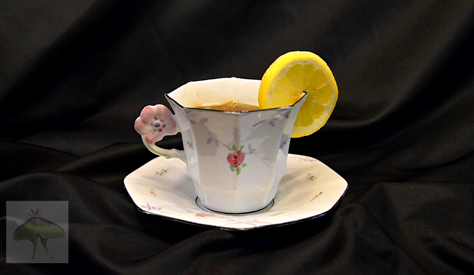 The Gatsby Infusion (Limited Edition) - A prized highlight of my collection, this elegant Art Deco teacup and saucer is prominently displayed in my china cabinet.  The design is remarkably delicate, featuring a dainty floral handle and whisper-soft, 