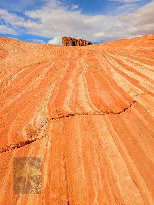 Climbing Up Fire (Limited Edition)-Valley of Fire State Park located in Nevada is another exciting place to visit.  The Aztec sandstone reflects the sun’s rays making it look as if it were on fire. After hiking down one of the heavily striped rock fo