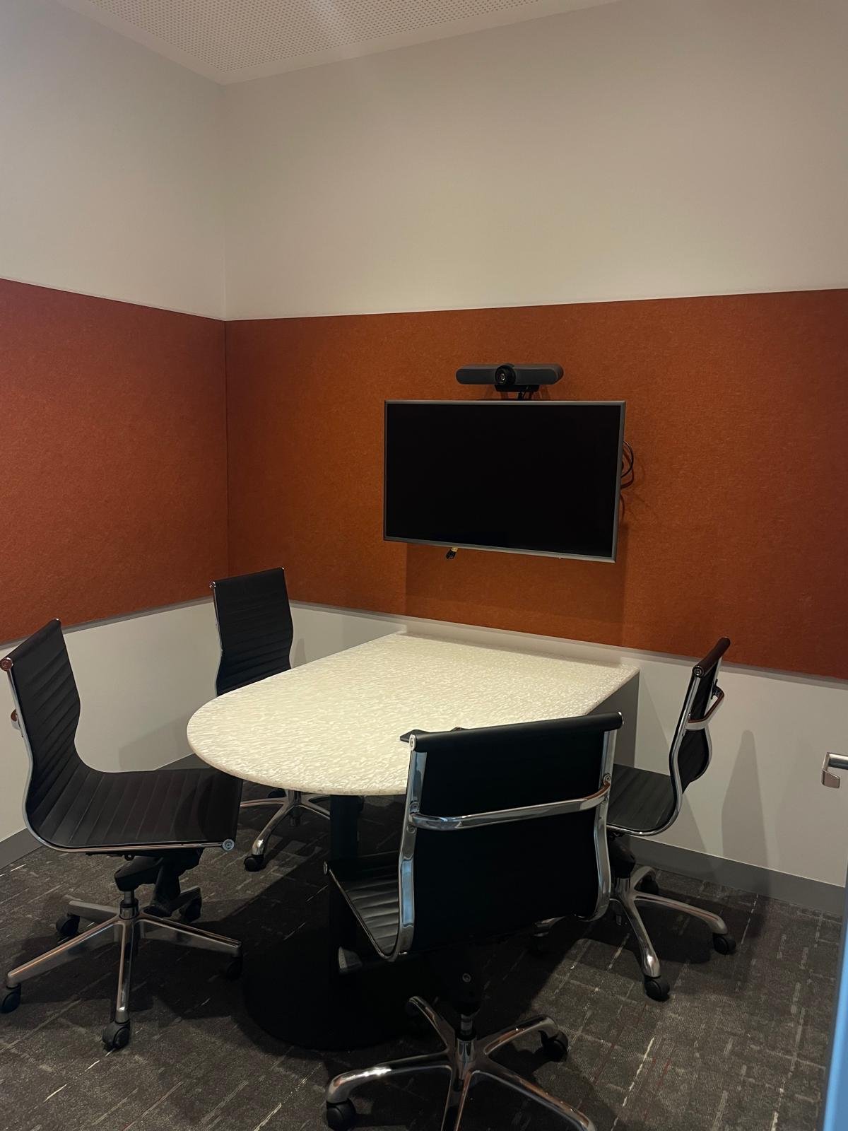The small meeting room at the warehouse.