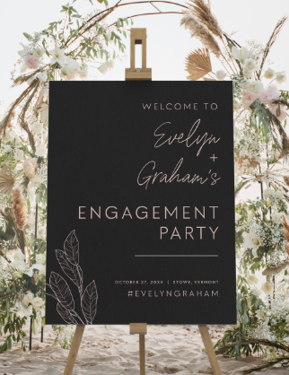 Sign welcoming guests to Evelyn and Graham's engagement party, set against a floral backdrop.