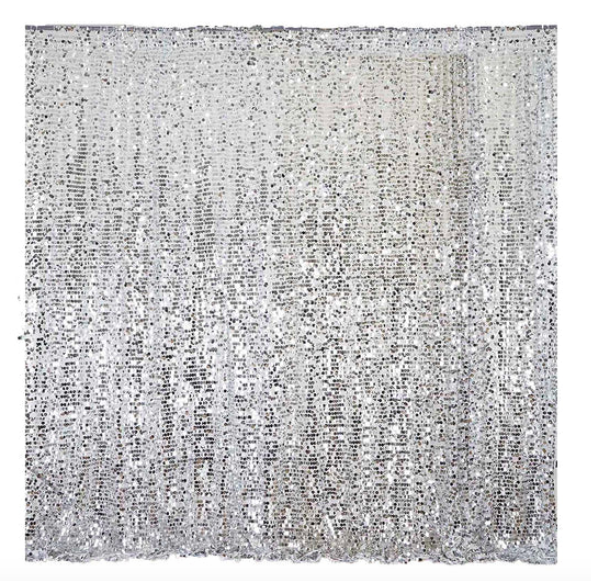 Silver sequin backdrop with sparkling effect.