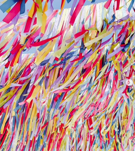 Colorful ribbons hanging from above, creating a festive atmosphere.