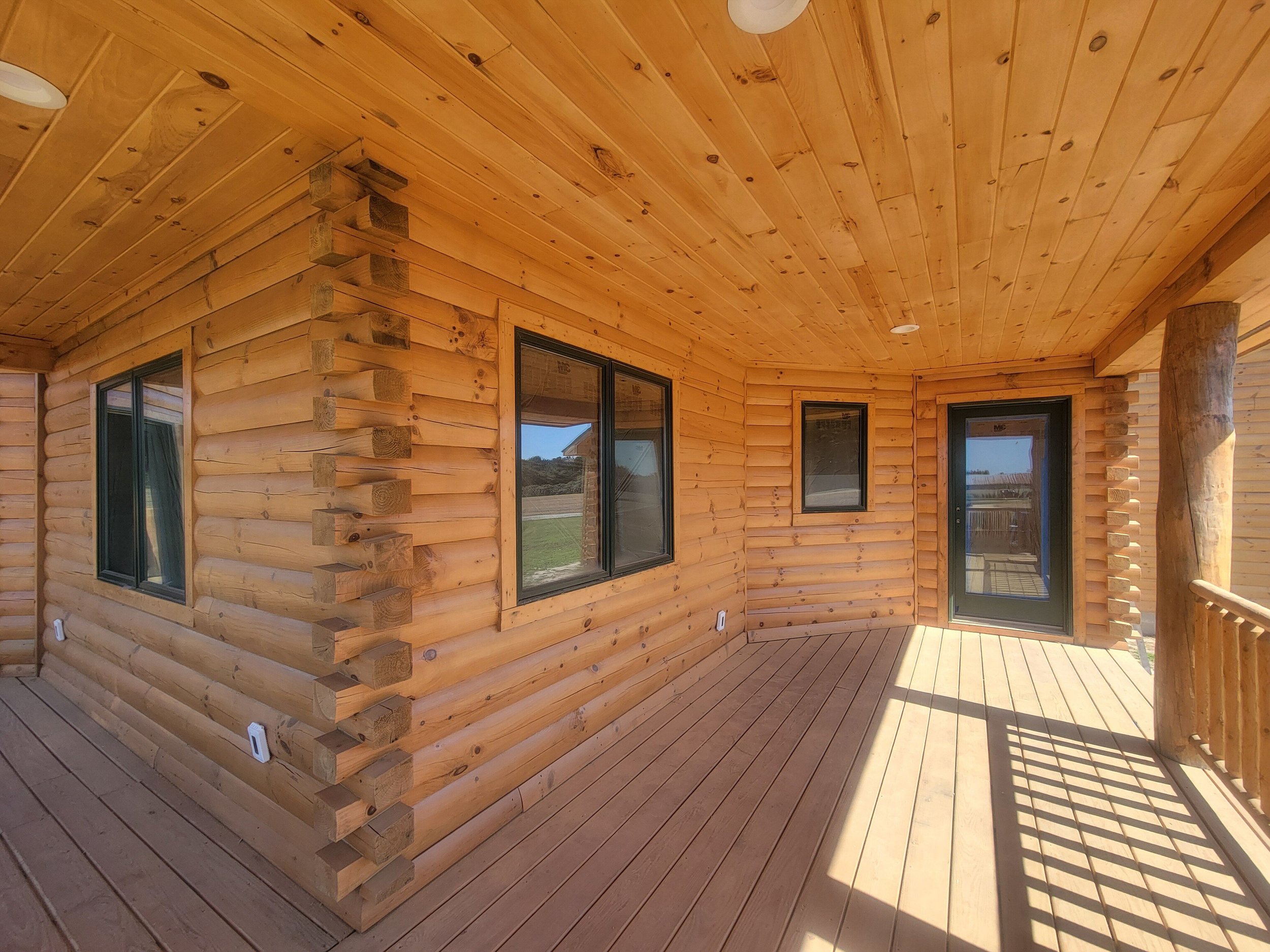 This is a completed photo (decks excluded). After applying borate, we used Sashco's Colorfast pre-stain, Capture color in Autumn Aspen, and Cascade clear coat.
