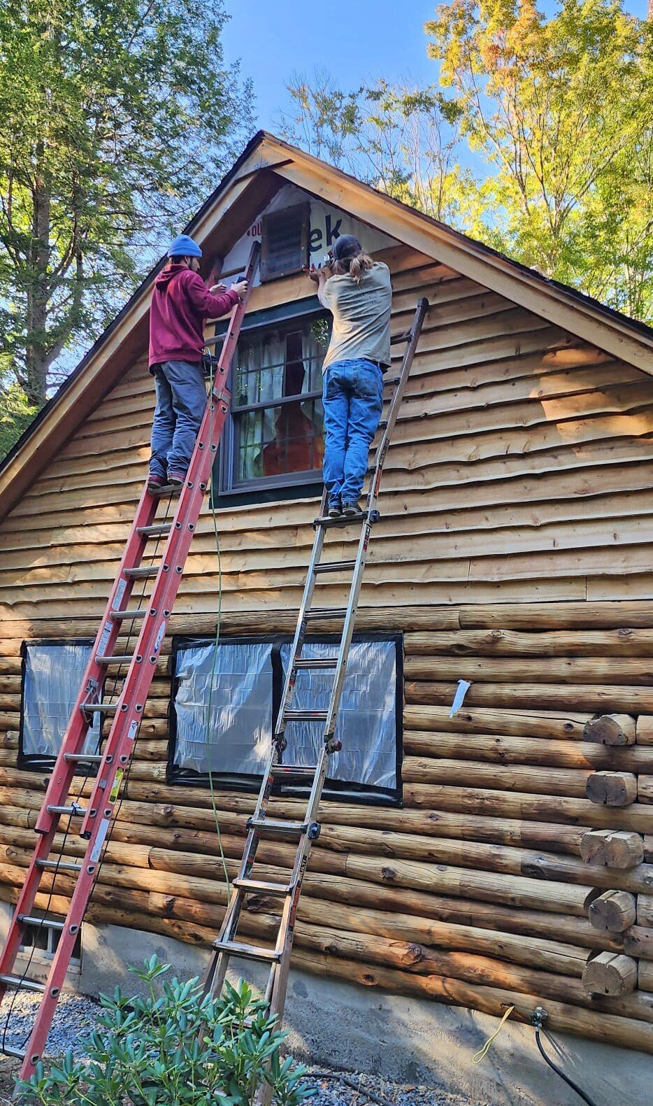 Installing wavy edge siding.