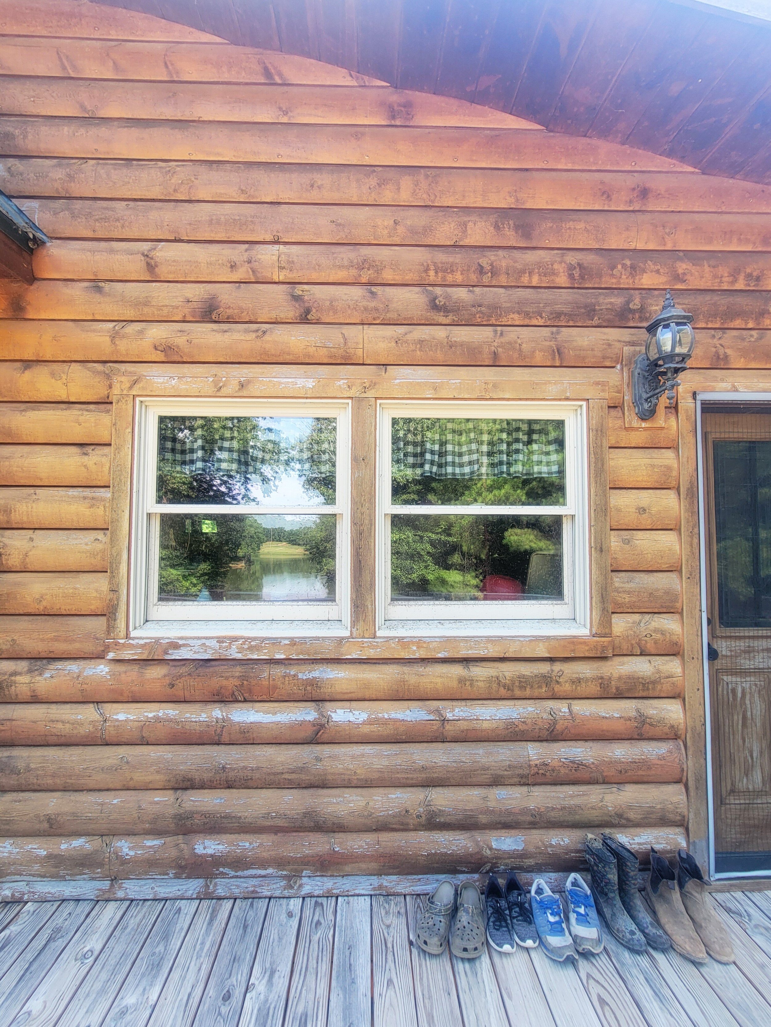 Before, showing wear on the logs' finish.