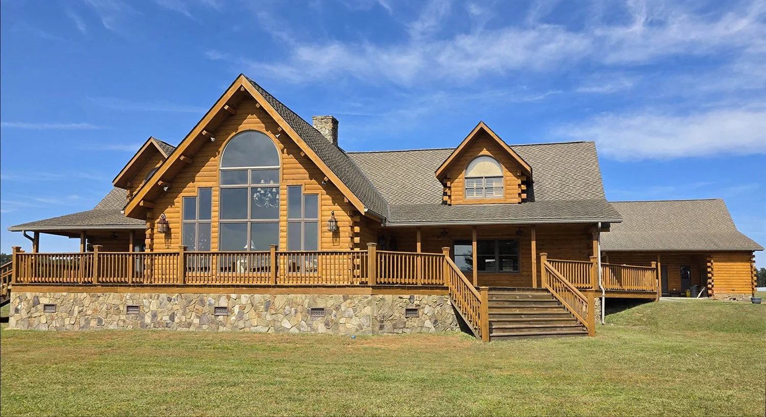 This home is boss now that the boss had us refinish it. We media blasted, borated, and applied Perma-Chink System's Lifeline Prelude primer, Ultra 2 in Dark Honey, and Advance Clear coat to protect it.