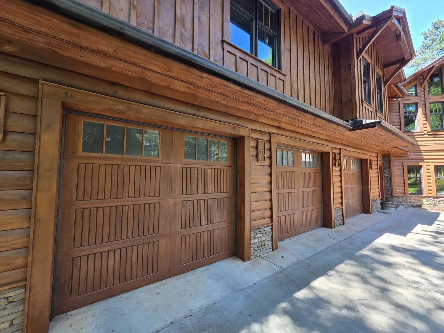 The new stain matches the home's garage doors perfectly, as intended.