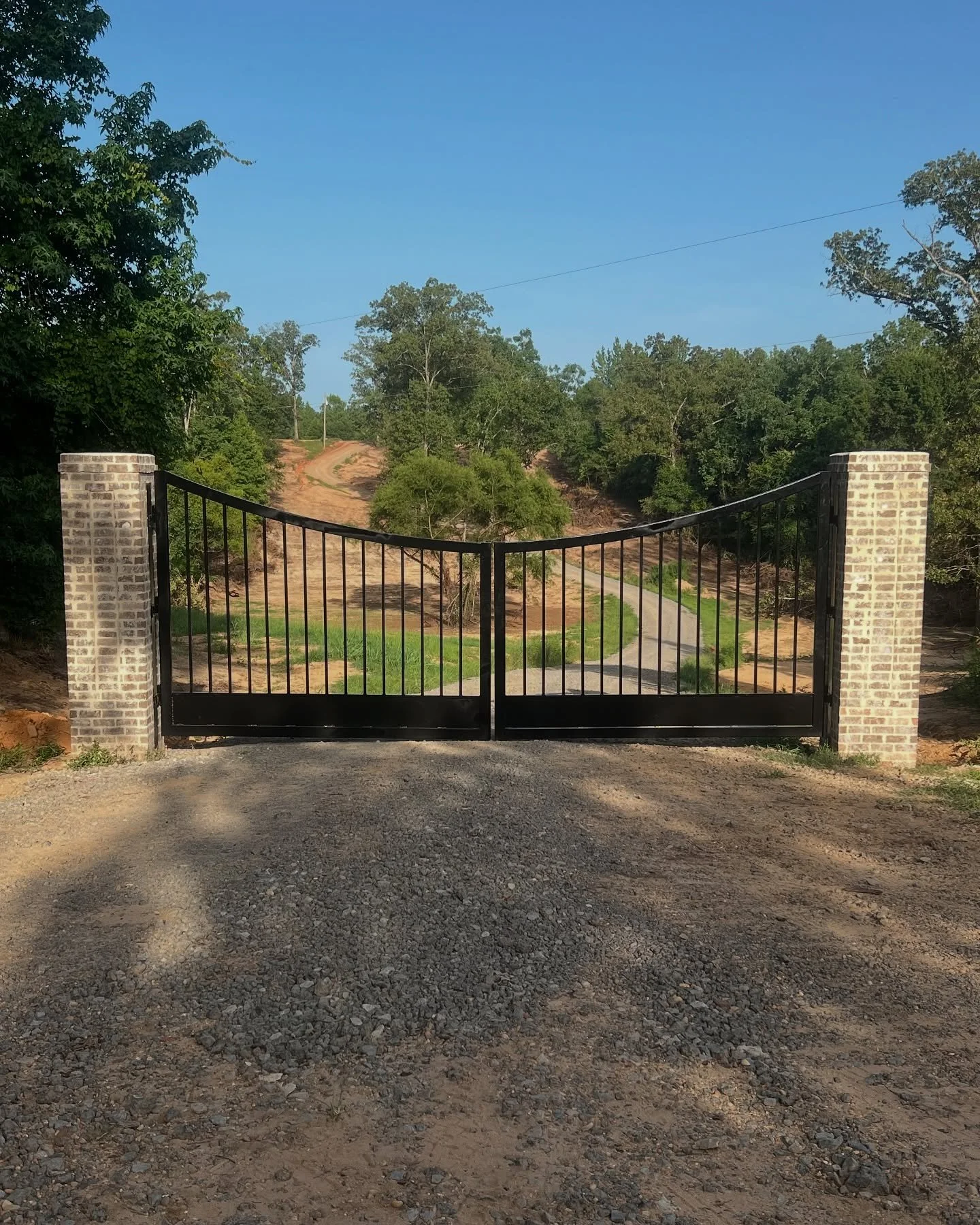 Custom gate project complete with automatic gate openers