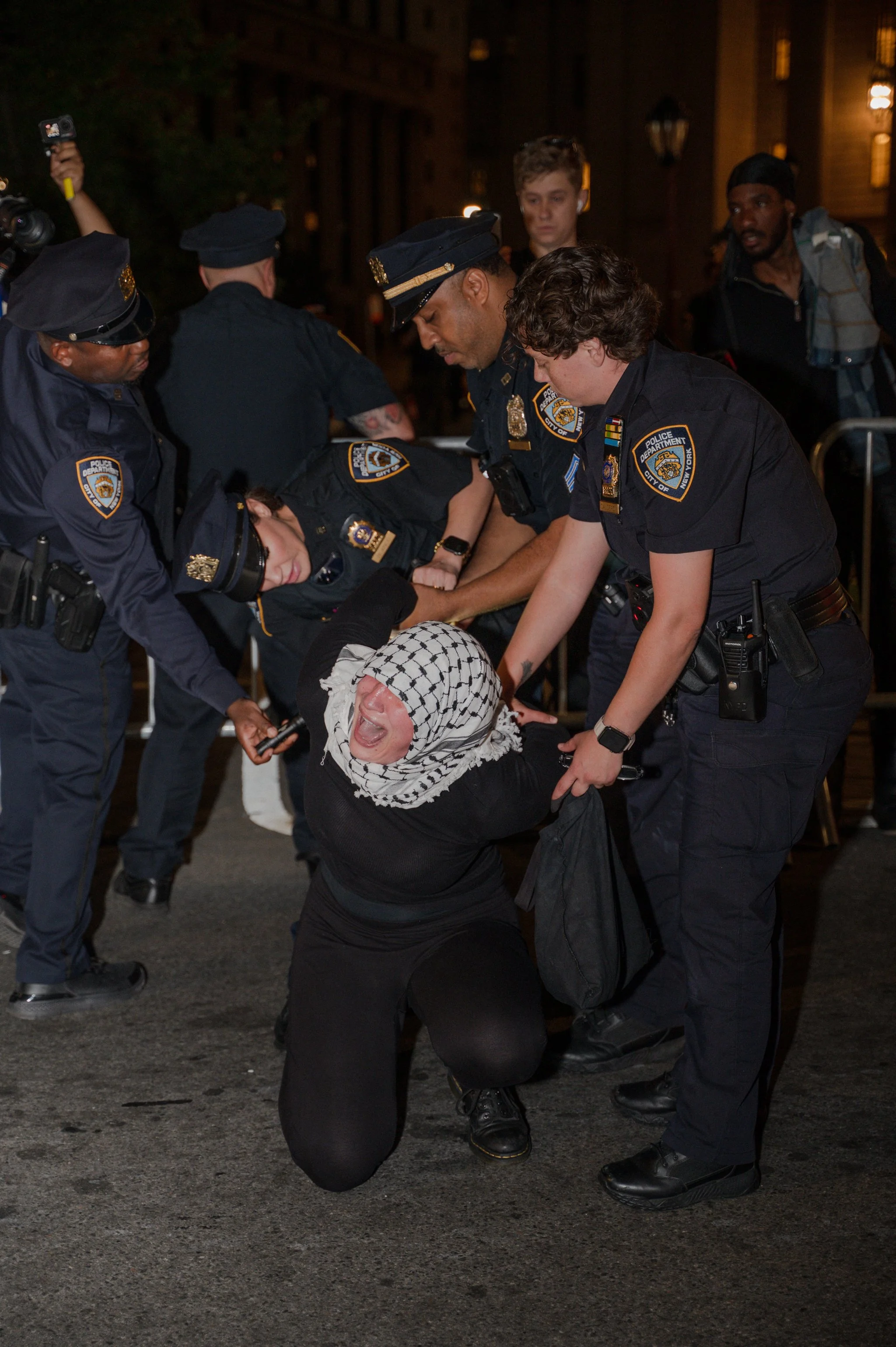 NYPD officers making arrests at Foley Square as protesters return to the plaza at the end of a march against ICE raids (June 10, 2025)