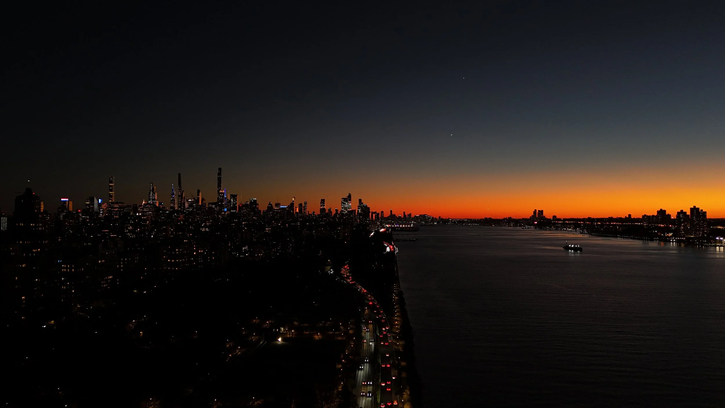 Aerial drone photograph over the New York coastline at golden hour, captured by JCF Timeless Productions