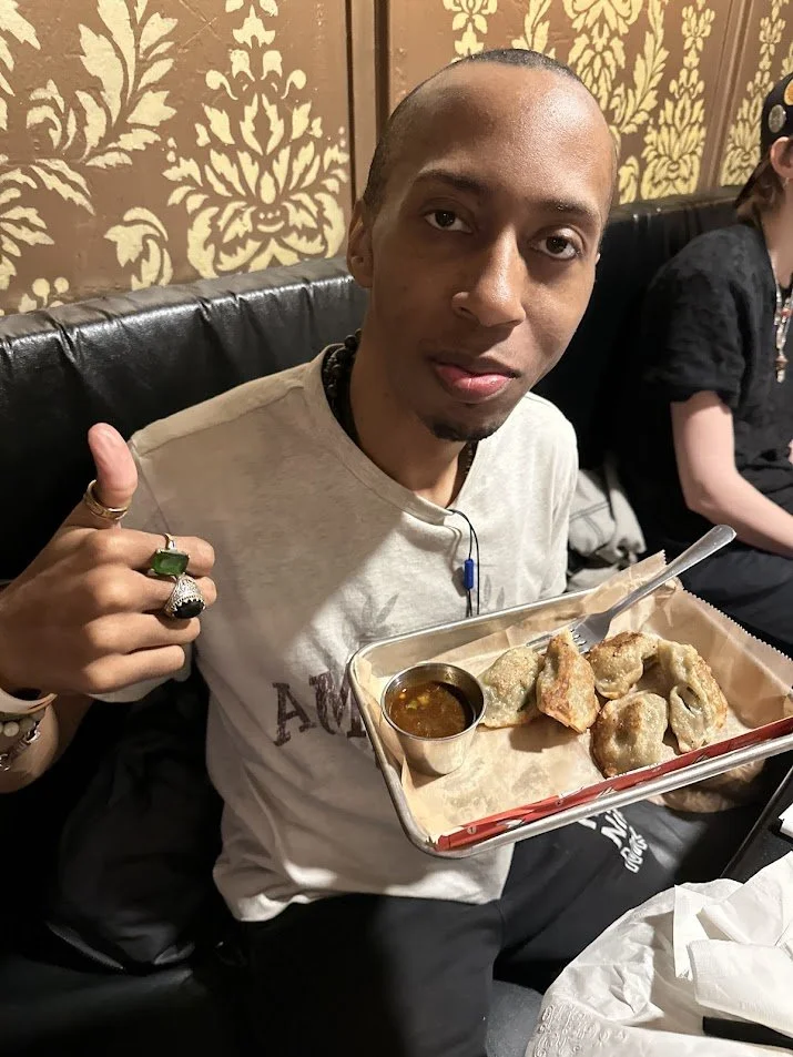 Josh with vegan potstickers at our Vegan Game Night.jpg