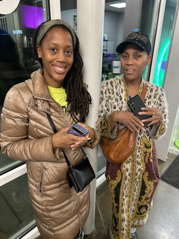 Two Adina's Vegan Cuisine regulars waiting for food at our Vegan Thanksgiving Feast in St. Louis, Missouri.jpg