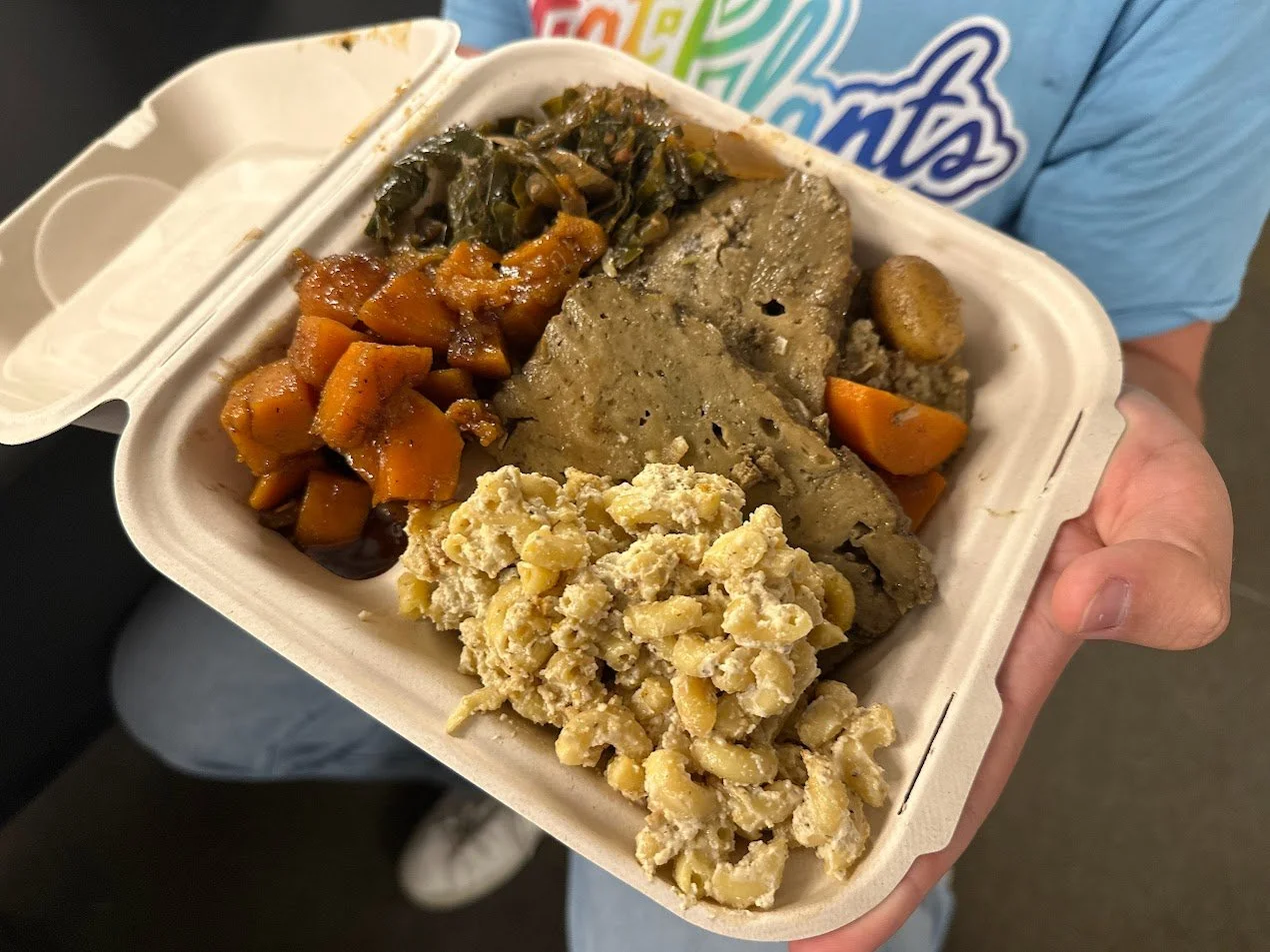 Troy admiring his vegan Thanksgiving platter at our Vegan Thanksgiving Feast with Adina's Vegan Cuisine in St. Louis, Missouri.jpg