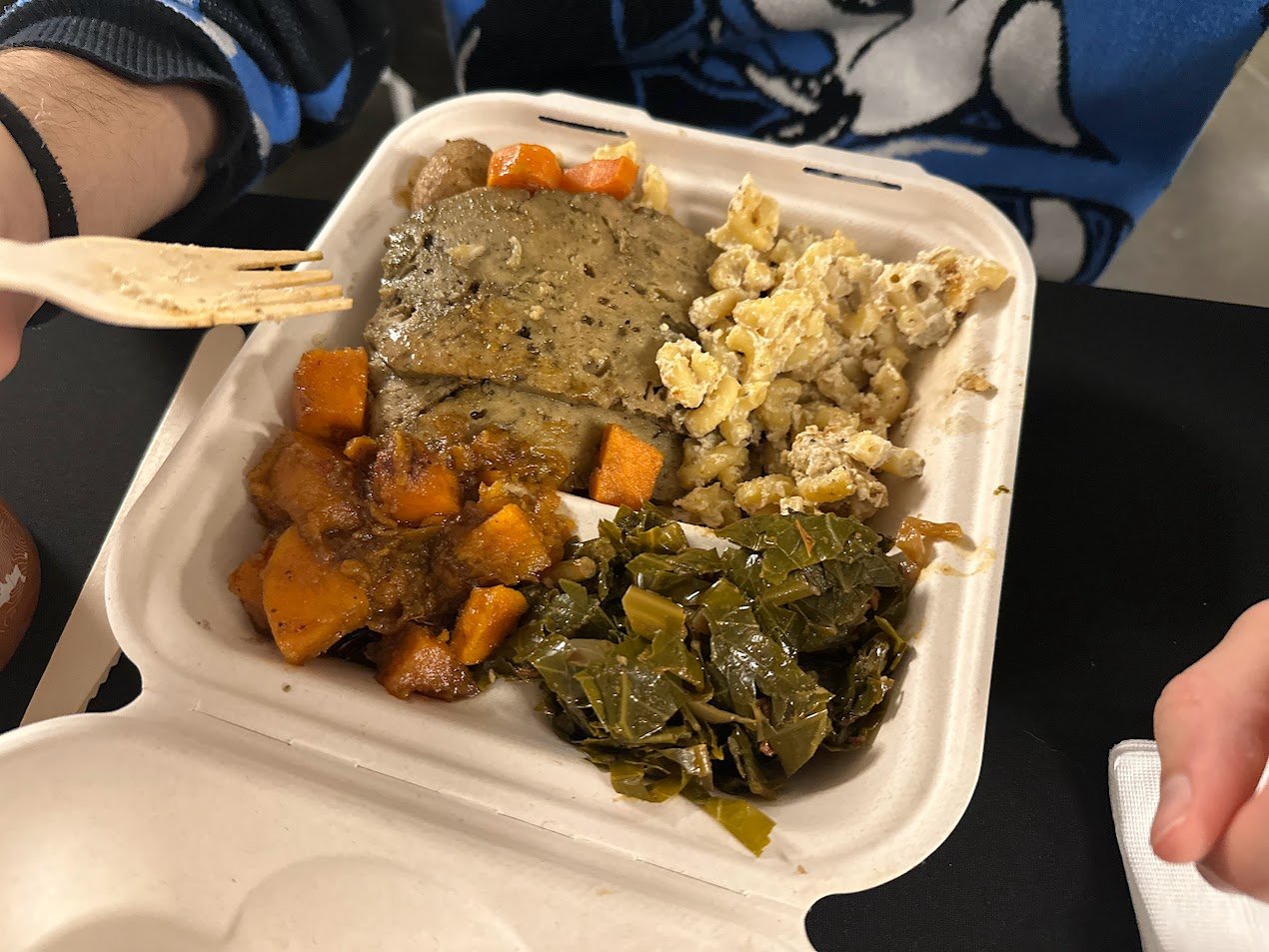 Vanya holding a vegan Thanksgiving platter at our Vegan Thanksgiving Feast with Adina's Vegan Cuisine in St. Louis, Missouri.jpg