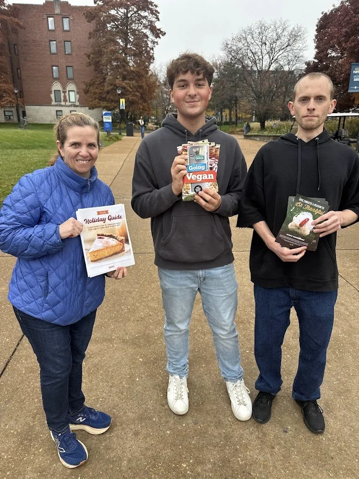 Jenna Luzynski with Troy and Craig distributing vegan leaflets at St. Louis University just before Thanksgiving.jpg