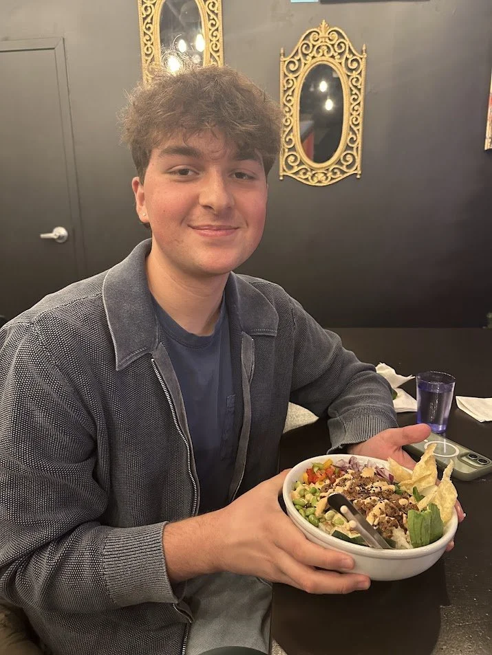 Troy proudly displaying his vegan bowl with Harvest Shreds at our Vegan Game Night and St. Louis Veganuary campaign meeting at Pieces Board Game Bar and Cafe in Soulard.jpg
