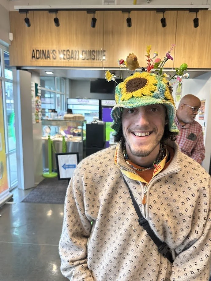 Paulie standing in front Adina's Vegan Cuisine at our vegan brunch near University City in St. Louis, Missouri.jpg