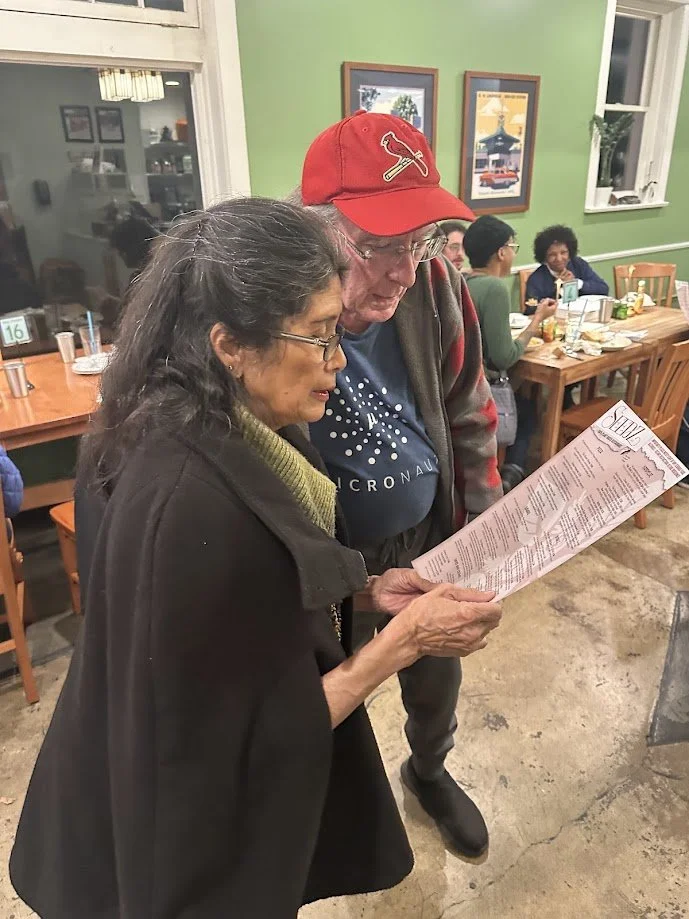 Hera and Al Gerber ordering food at our vegan meetup at Seedz Cafe near Forest Park in St. Louis, Missouri.jpg