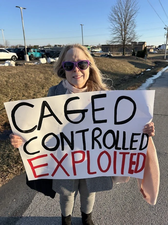 Krissy holding a sign protesting the circus.jpg