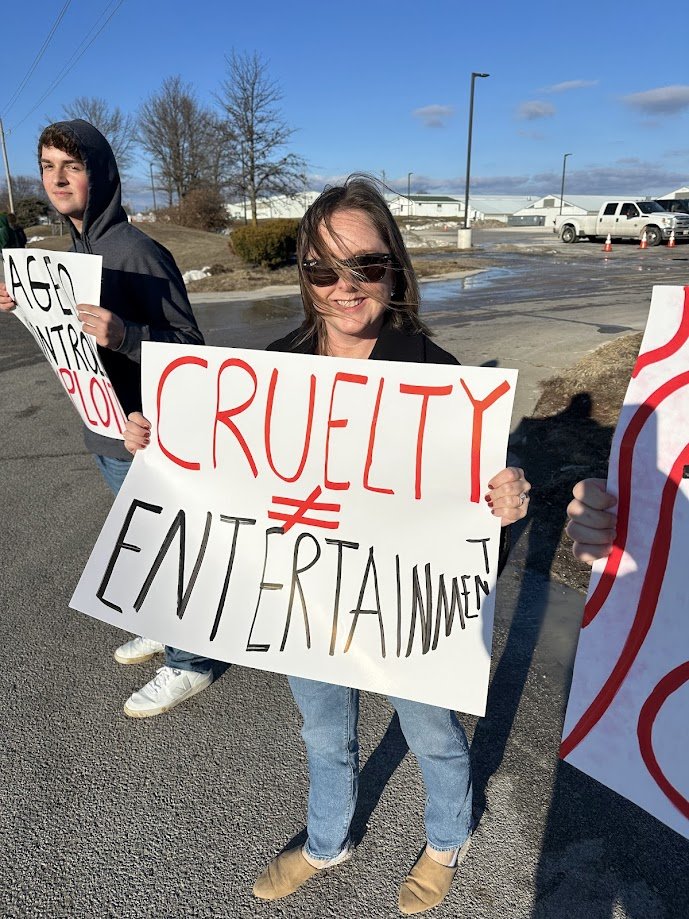 Nicole holding a sign protesting the circus.jpg