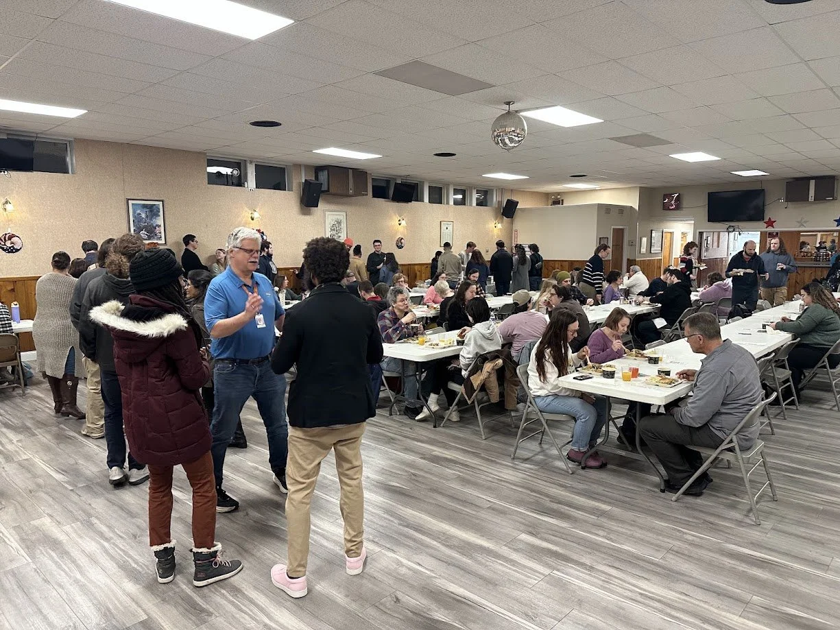 People standing in line and eating at our Plant Italia Dinner at American Legion Post 111 in Shrewsbury, Missouri.jpg