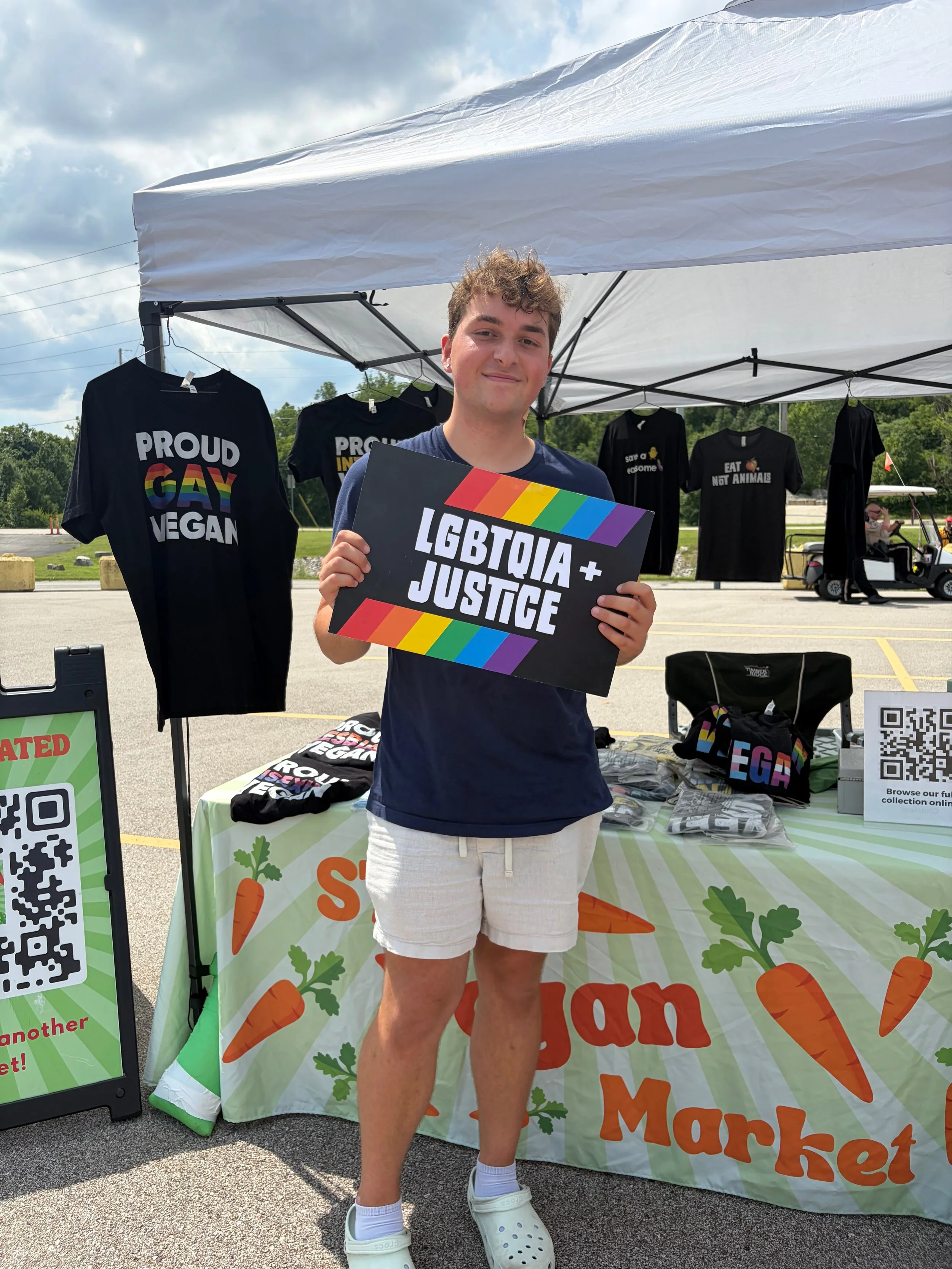 Troy, a vegan animal rights activist and volunteer coordinator for Project Animal Freedom, at our STL Vegan Market pop-up booth at Pride St. Charles.jpg